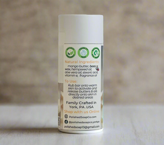 Tube of soap with natural ingredients label on a light wooden surface